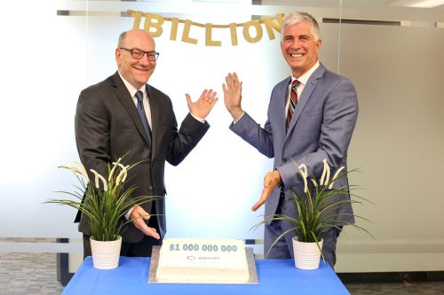 2018 — $1 billion in accumulated collaborative spend by OECM customers is celebrated; Left to right: Board Chair, Arnie Strub, and President and CEO, John Sabo 