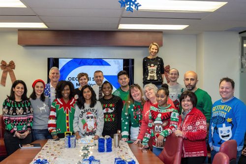 2018 — Staff sporting holiday sweaters