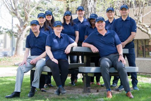 2022 — Executive team on a picnic bench. Left to right: Len Scavuzzo, Belinda Yu, Sonia Gallo, Karen Owen, Pooja Nagra, Jim Hadjiyianni, Fadina Allen, John Sabo, Ken Voong, and Perry Arzumanian