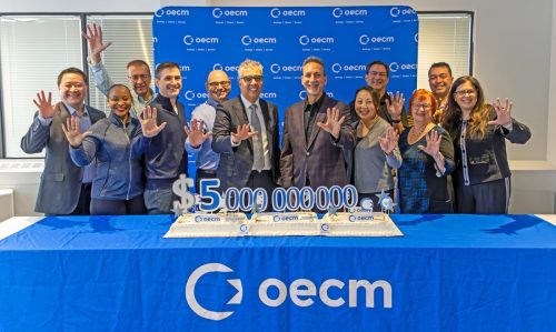 2024 — OECM's executive team and board chair celebrating $5 billion spend milestone. Left to right: Patrice Likamshum, Shelly Ann Henry, Len Scavuzzo, Ben Hamilton, Perry Arzumanian, Dr. F. Haider Alvi, Jim Hadjiyianni, Belinda Yu, Tibor Galambos, Karen Owen, Khusen Shukurov, and Sonia Gallo